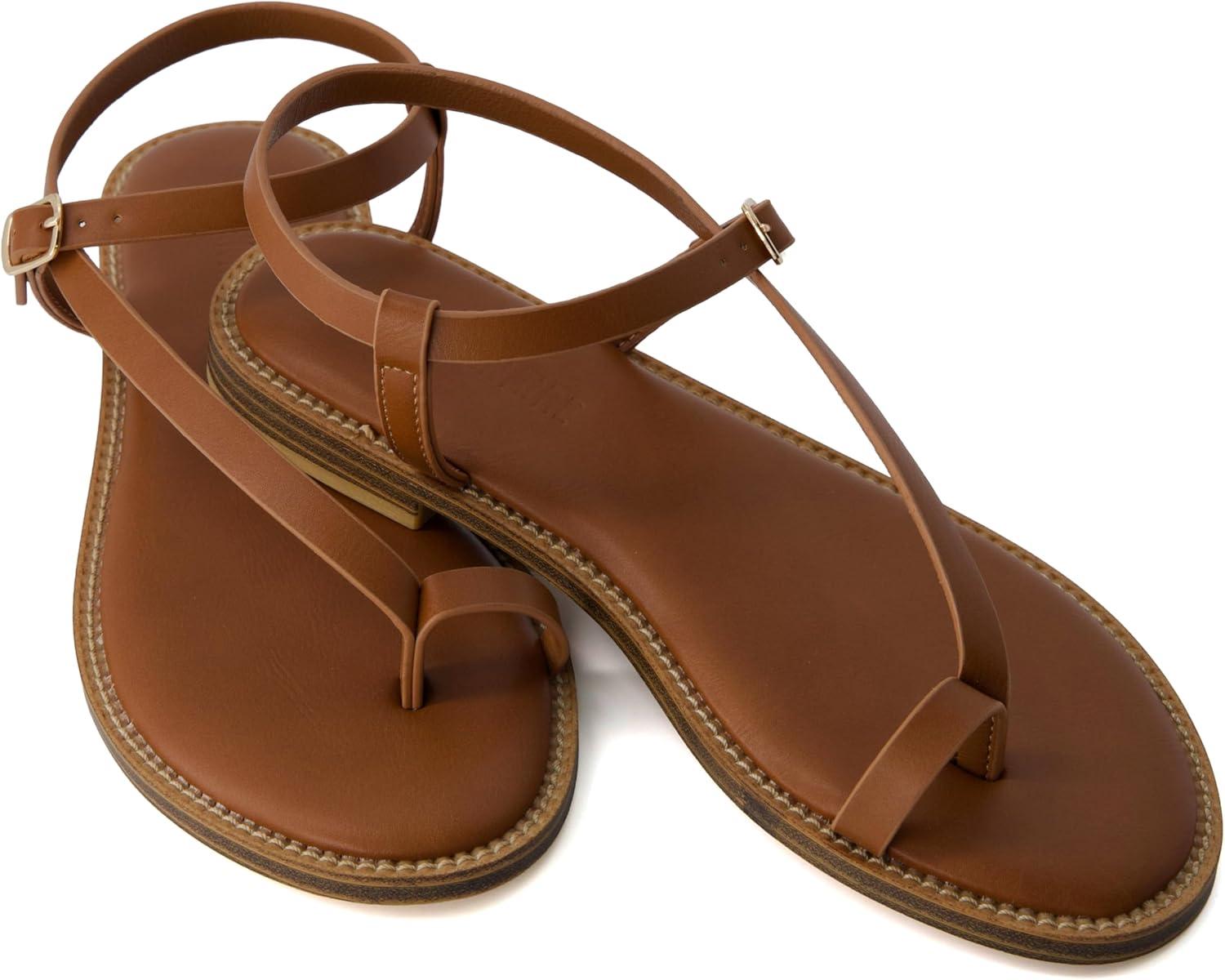 imageCUSHIONAIRE Life Strappy Flat Thong Sandals for Women with Toe Loop Memory Foam and Adjustable Ankle Strap Womens SandalsWhiskey