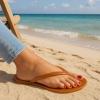 imageCUSHIONAIRE Splash Jelly Flip Flops for Women With Flexible Sole Soft Footbed Summer Sandals for WomenWhiskey