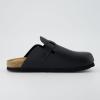 imageCUSHIONAIRE Kids Hana Cork footbed clog with Genuine Leather upper Faux Fur lining and ComfortBlack